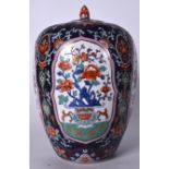 A LARGE PORCELAIN GINGER JAR DECORATED IN THE CHINESE TASTE, decorated with panels of precious obje