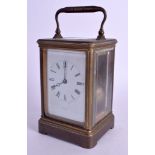 AN ANTIQUE TIFFANY & CO BRASS STRIKING CARRIAGE CLOCK. 17.5 cm high inc handle.