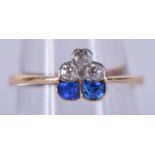 AN UNUSUAL 9CT GOLD DIAMOND AND SAPPHIRE RING. 1.6 grams. Size K/L.