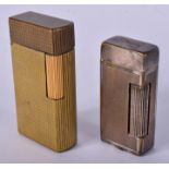 TWO 1920S DUNHILL LIGHTERS. 5.75 cm & 5 cm high. (2)
