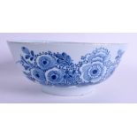 A MID 18TH CENTURY ENGLISH LONDON DELFT CIRCULAR BOWL C1750 painted with flowers and vines. 26.5 cm