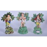 THREE 19TH CENTURY WALTON POTTERY FIGURINES, a gardener, together with two others. 16 cm. (3)