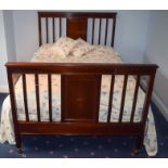 AN EDWARDIAN MAHOGANY BED, decorated with satinwood inlay. 201 cm x 141 cm.