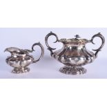 A 19TH CENTURY RUSSIAN TWIN HANDLED SUGAR AND COVER together with another silver cream jug. 820 gra