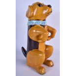 A 1930'S FAIENCE POTTERY FIGURE OF A BEGGING DOG, formed with amber coloured glass eyes. 36 cm high