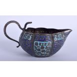 AN ANTIQUE INDIAN ENAMELLED SILVER JUG. 113 grams. 12 cm wide.