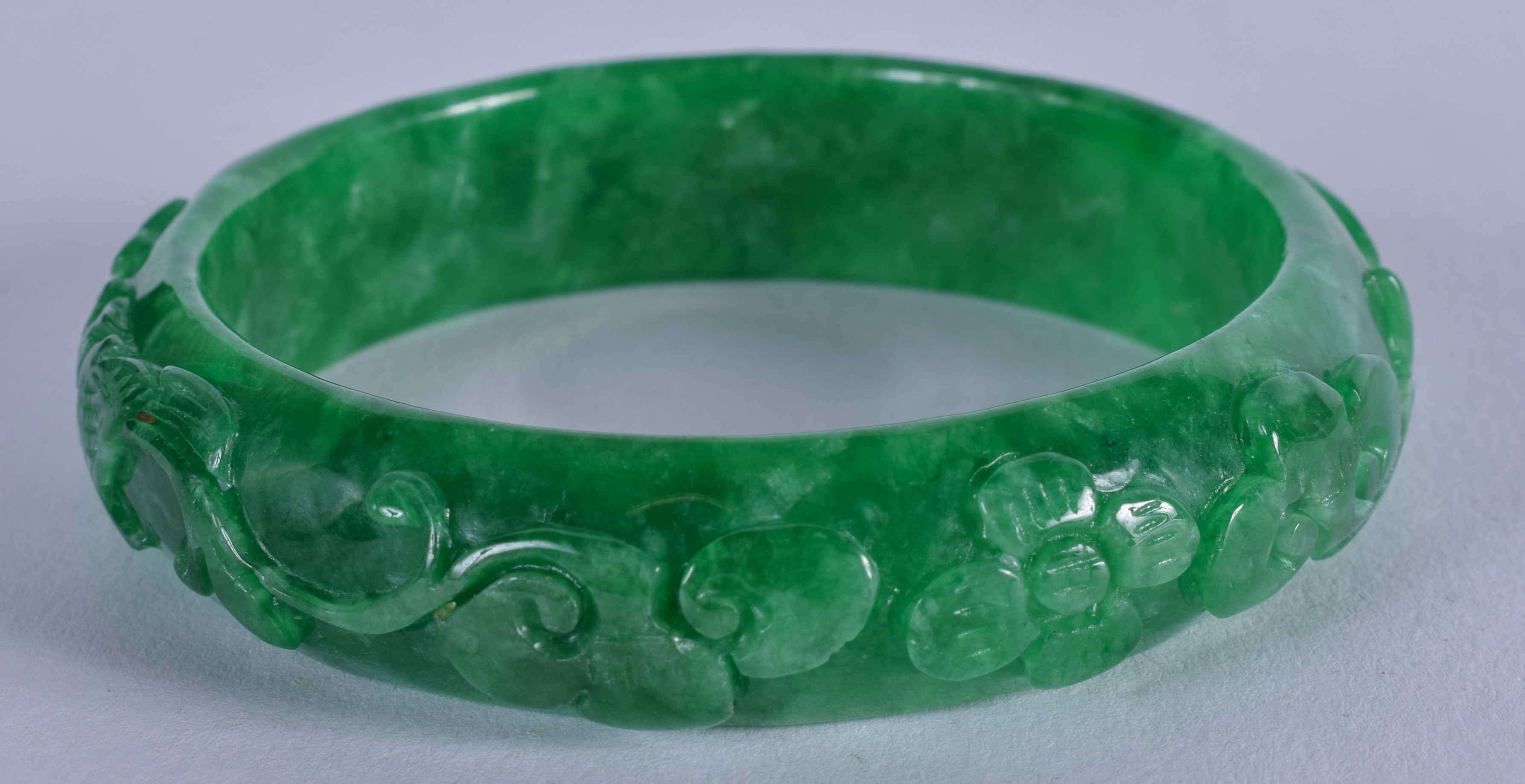 A CHINESE JADE BANGLE. 7.5 cm wide. - Image 2 of 2