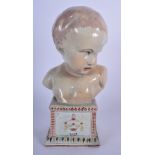 A 19TH/20TH CENTURY STAFFORDSHIRE POTTERY BUST OF A CHILD, formed upon a plinth decorated with prec