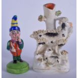 A 19TH CENTURY STAFFORDSHIRE POTTERY FIGURE OF MR PUNCH, together with a small ram figurine. Larges