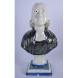 AN EARLY 19TH CENTURY PEARLWARE BUST OF JOHN WESLEY, formed upon a lobed base. 25 cm high.