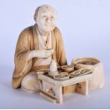 A LOVELY 19TH CENTURY JAPANESE MEIJI PERIOD CARVED IVORY OKIMONO modelled as a male enjoying tea be