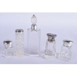 FIVE VINTAGE SILVER TOPPED GLASS DRESSING TABLE JARS. Largest 11 cm high. (5)