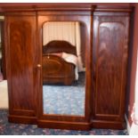 A VICTORIAN FLAME MAHOGANY COMPACTUM, formed with large central mirror. 208 cm x 213 cm.