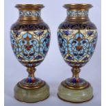 A PAIR OF 19TH CENTURY FRENCH CHAMPLEVE ENAMEL VASES decorated with foliage. 12.5 cm high.