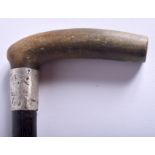 A 19TH CENTURY RHINOCEROS HORN HANDLED WALKING CANE. 88 cm long.