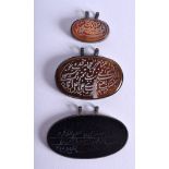 THREE MIDDLE EASTERN ASIAN HARDSTONE PENDANTS. (3)