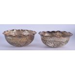 A PAIR OF VINTAGE MIDDLE EASTERN SILVER BOWLS. 316 grams. 14 cm wide.