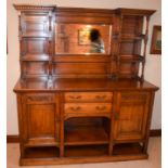 A GOOD ARTS AND CRAFTS SIDEBOARD IN THE MANNER OF SHAPLAND & PETTER BARNSTABLE, inset with mirror a