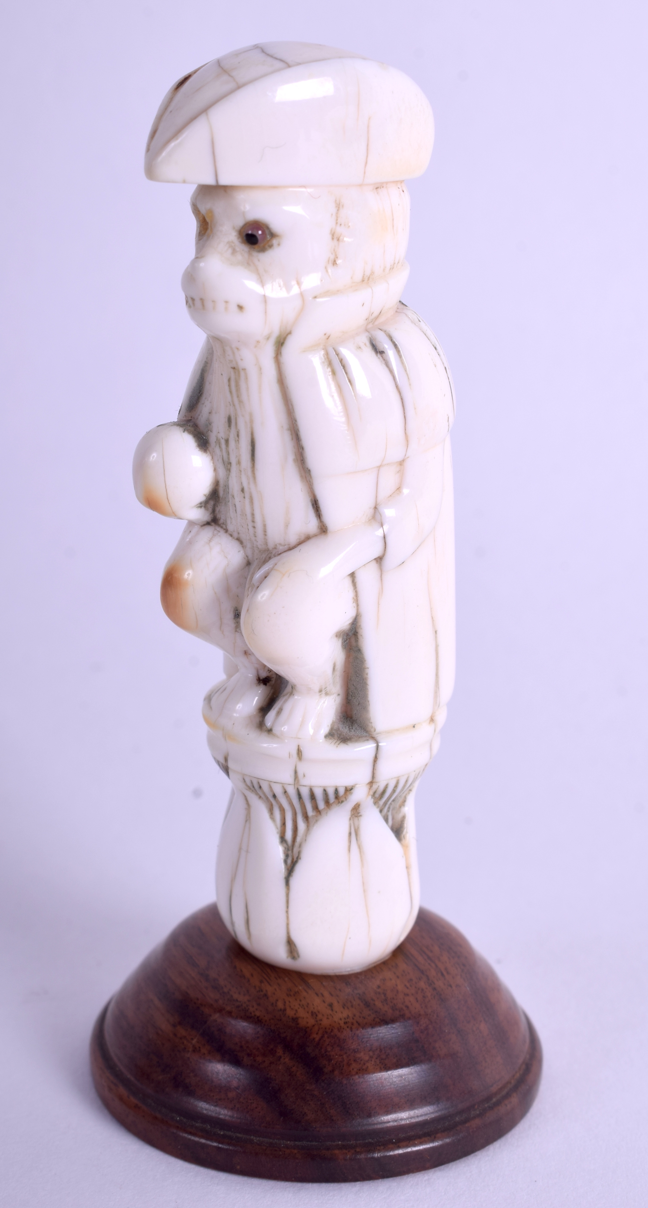 AN 18TH CENTURY CARVED CONTINENTAL IVORY FIGURE OF A MONKEY in the form of a naval officer. Ivory 7