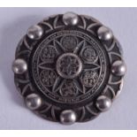 A VINTAGE ORTIZA SILVER ARTS AND CRAFTS TYPE BROOCH. 3.75 cm diameter.
