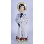 A 19TH CENTURY STAFFORDSHIRE FIGURINE OF THE PRINCE OF WALES, modelled dressed as a sailor. 31 cm h