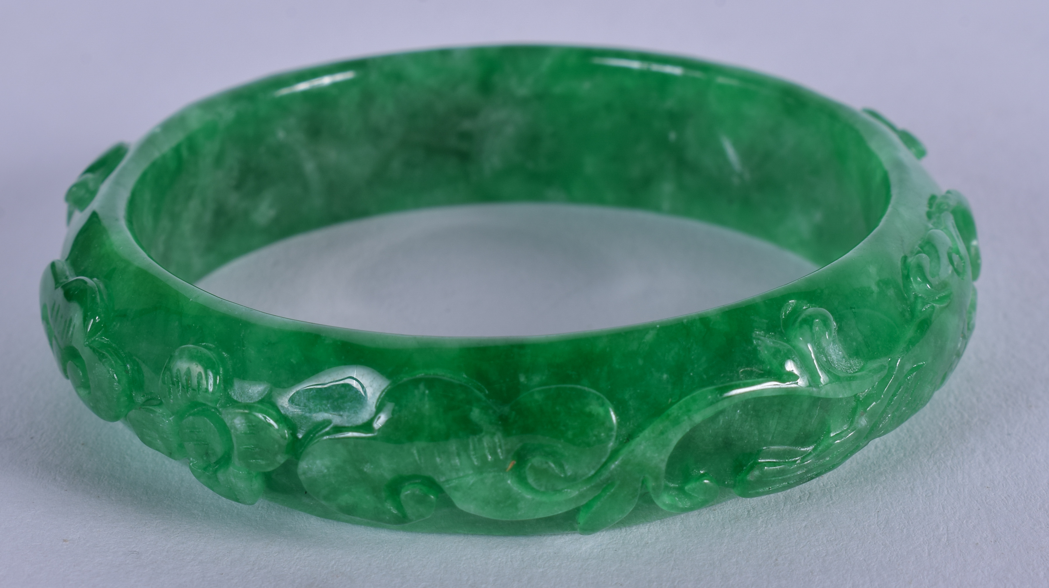 A CHINESE JADE BANGLE. 7.5 cm wide.