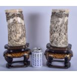 A LARGE PAIR OF 19TH CENTURY JAPANESE MEIJI PERIOD CARVED IVORY TUSK VASES upon lacquered bases. 37