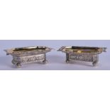 A PAIR OF RUSSIAN SILVER SALTS. 1.5 oz. 8 cm wide.