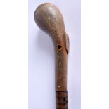 A 19TH CENTURY RHINOCEROS HORN HANDLED WALKING CANE of sectional form. 90 cm long.