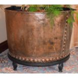 A HUGE COPPER PLANTER, formed with studwork banding. 62 cm x 76 cm.