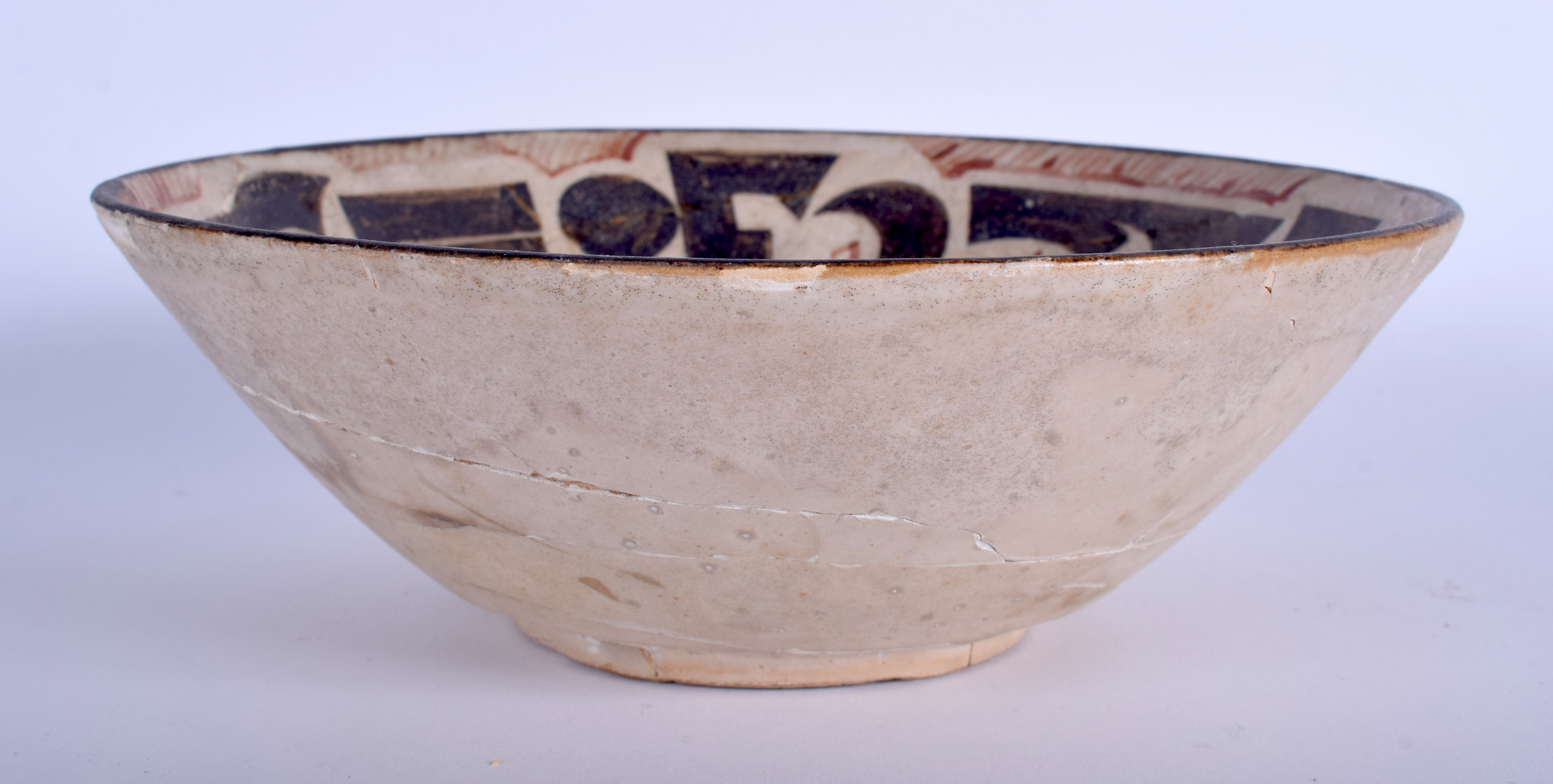 A MIDDLE EASTERN KASHAN BOWL. 19 cm diameter.