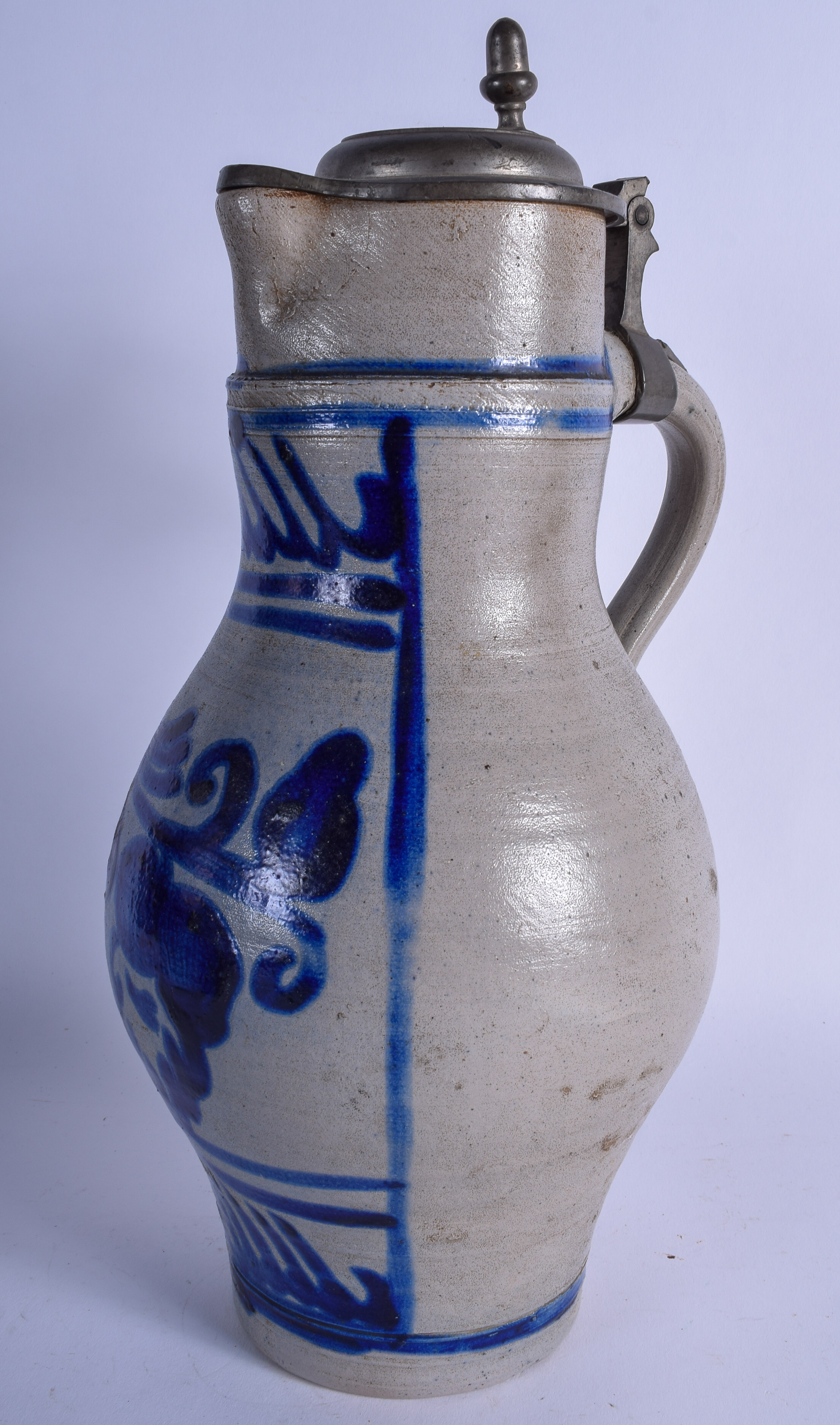A STONEWARE JUG, with pewter mounts. 38 cm.
