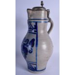 A STONEWARE JUG, with pewter mounts. 38 cm.