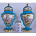 A LARGE PAIR OF 18TH/19TH CENTURY SEVRES PORCELAIN VASES AND COVERS painted with romantic scenes. 3