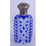 AN ANTIQUE SILVER BOHEMIAN BLUE FLASH SCENT BOTTLE. 9 cm high.