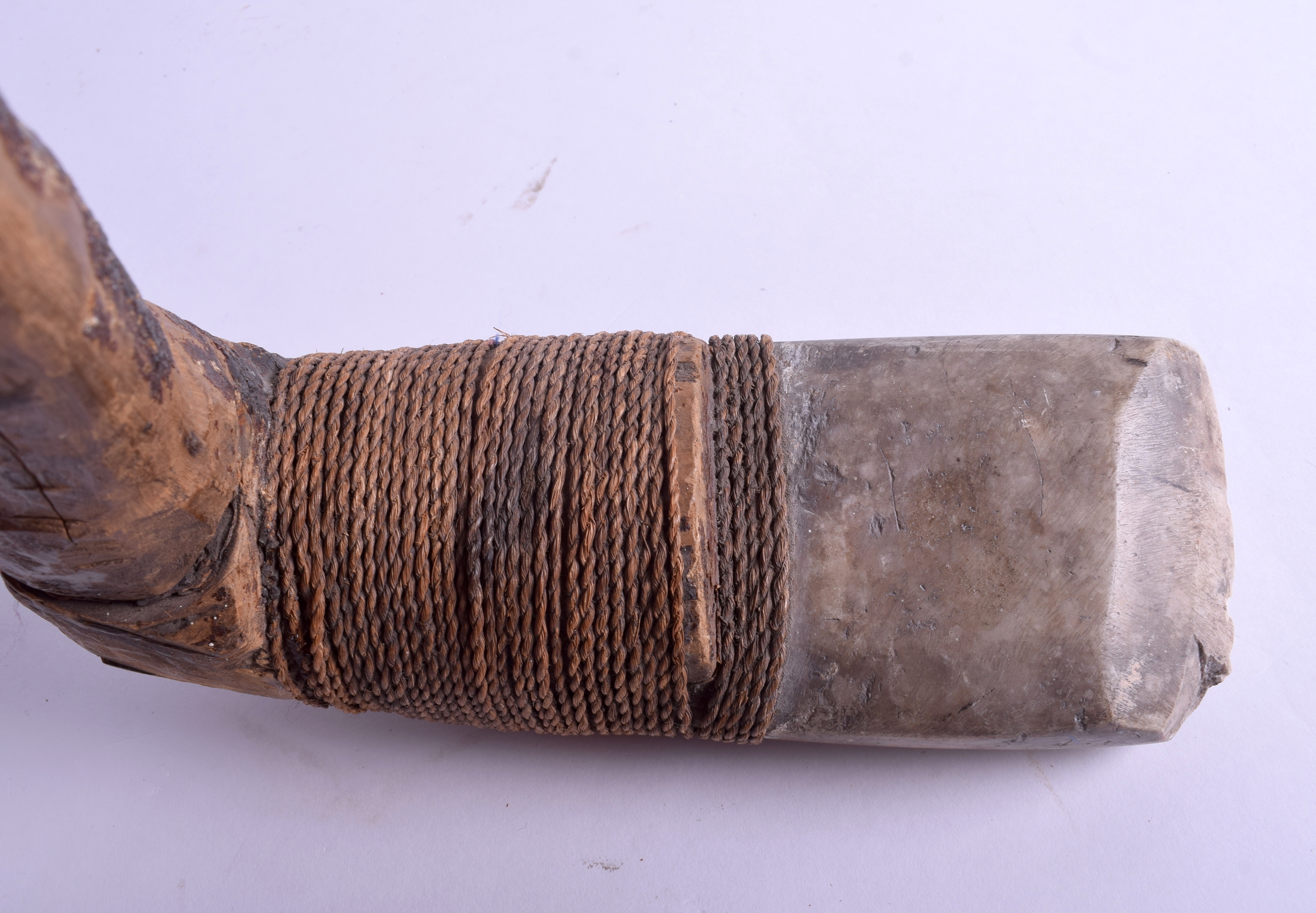 AN UNUSUAL 19TH CENTURY CARVED STONE TRIBAL ROPE BOUND AXE. 56 cm x 25 cm. - Image 4 of 4