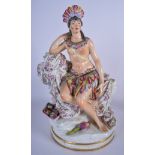 A LARGE PORCELAIN FIGURAL GROUP OF A SOUTH AMERICAN FEMALE, formed beside a nude boy seated upon a