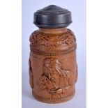 A 19TH CENNTURY SALT GLAZED STONEWARE SNUFF JAR AND COVER. 13.5 cm high.