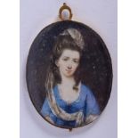 AN EARLY 19TH CENTURY PAINTED IVORY PORTRAIT MINAITURE. 4.5 cm x 6 cm.