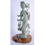 A LARGE EARLY 20TH CENTURY CHINESE CARVED JADEITE IMMORTAL modelled holding aloft foliage. 27 cm hi