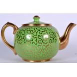 A SUDLOWS BURSLEM GREEN GROUND TEA POT, formed with gilded decoration to body. 25.5 cm wide.