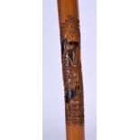 A JAPANESE MEIJI PERIOD BAMBOO WALKING CANE, carved with a figure beneath a tree full of monkeys. 9