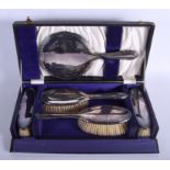 A CASED ENGLISH SILVER DRESSING TABLE SET. (5)