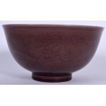 A CHINESE AUBERGINE GLAZED TEA BOWL Guangxu mark and possibly of the period. 10 cm wide.