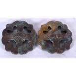 A PAIR OF IRANIAN BRONZE PLAQUES, formed with cross type design. 5.5 cm wide.