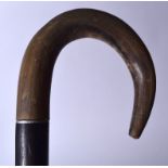 A 19TH CENTURY RHINOCEROS HORN HANDLED WALKING STICK, formed with a carved honeycomb body. 77 cm lo