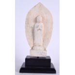 AN EARLY 20TH CENTURY INDIAN MARBLE BUDDHISTIC SHRINE, fitted upon a stepped wooden plinth. 38 cm h