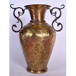 A LARGE EARLY 20TH CENTURY TWIN HANDLED PERSIAN BRASS VASE, decorated with figures and foliage in