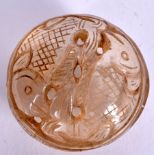 AN EARLY 20TH CENTURY PERSIAN ROCK CRYSTAL BOX AND COVER, carved with opposing fish. 5 cm wide.