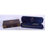 A COROMANDEL CAMPAIGN TYPE WOODEN BOX, together with a cased necklace. Box 18.75 cm wide. (2)